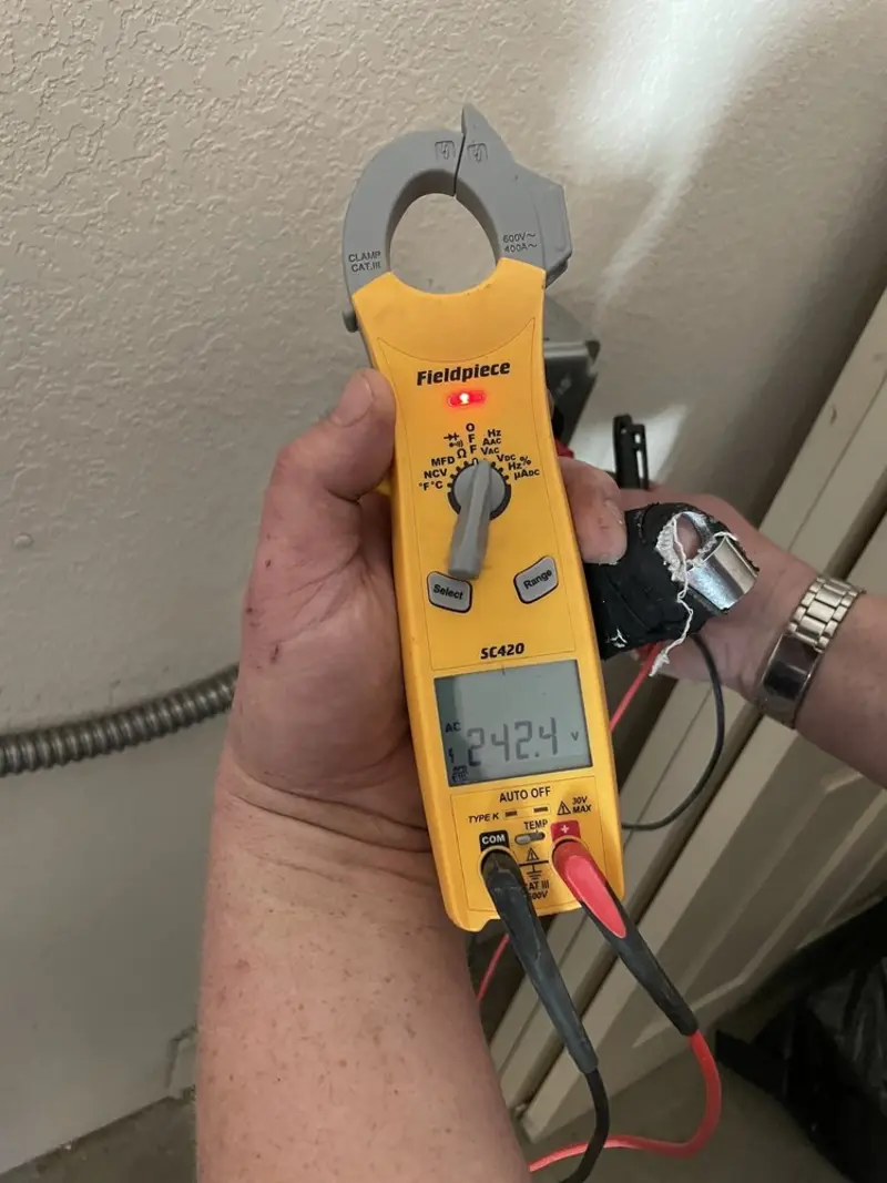 Voltage testing with clamp meter during Electrical Installation Services in Port Orange